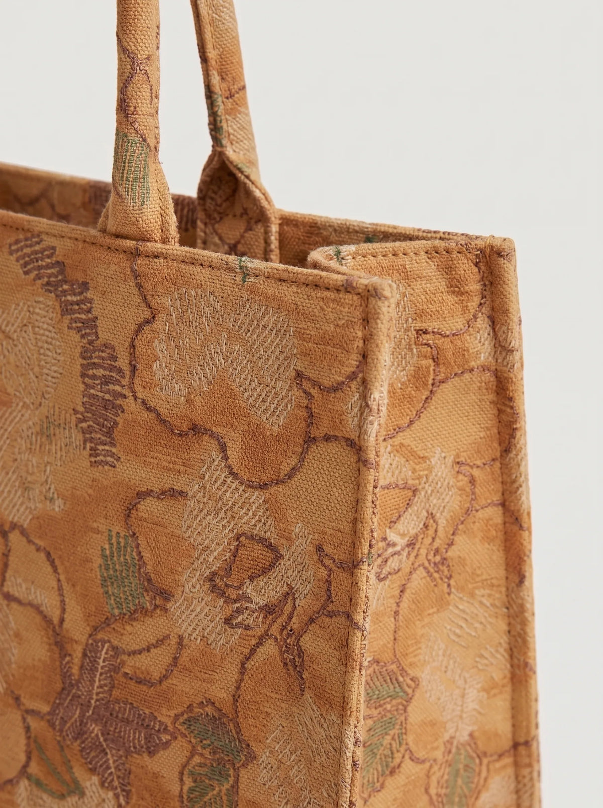 Close-up of Afroz.pk woven floral jacquard pattern on Desert canvas tote bag for women