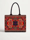 A structured tote bag with a vibrant, symmetrical multicolor floral and geometric pattern, featuring black shoulder straps and a beaded border, set against a plain light gray background.